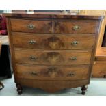 A Victorian mahogany and veneer bow fronted chest of two short and three long drawers, with ornate