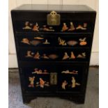A 20th century Majestic Co, Hong Kong ebonised hardwood cabinet, the top opening to a deep section