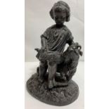 A spelter figure of a standing boy with a goat, 13cm high