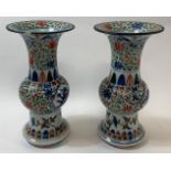 A pair of Chinese shaped vases, each decorated with a five clawed dragon either side, each with a