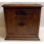 A late 19th/early 20th century light oak travelling letter rack/tidy box, with pull down section