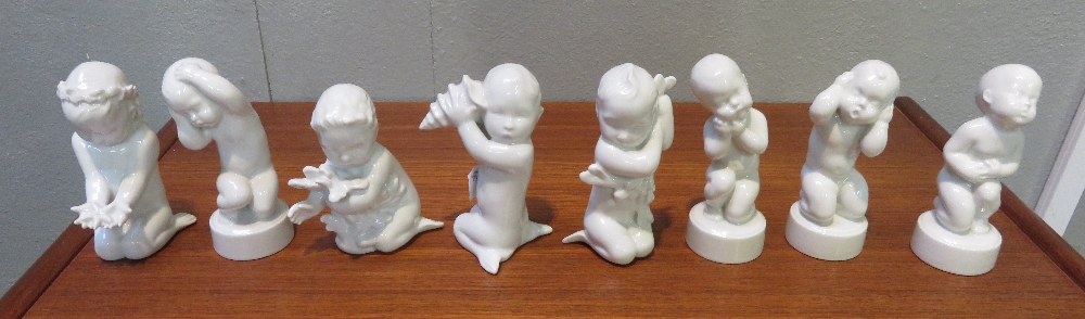 A set of four Bing and Grondahl figures from the “Aches” series, along with a set of four “Sea