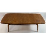 A mid 20th century Ercol beech and elm rectangular coffee table with stick under tier, on four