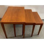A Danish mid-century nest of three graduated teak tables by Bent Silberg, Mobler, black stamps to