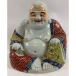 A large Chinese figure of Hotei, decorated with various coloured enamels, with a four character mark