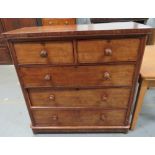 A Victorian mahogany veneer chest of two short and three long drawers, with turned handles and on