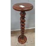A 19th/20th century mahogany jardiniere with round top, barley twist stem and stepped round base,