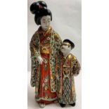 A 20th century Japanese figure of mother and child, decorated in relief, 27cm high