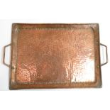 An Arts and Crafts Newlyn school rectangular two handled hammered tray by John Pearson, stamped JP
