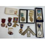 A collection of Masonic items including medals, books and others items