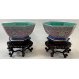 A pair of Chinese hexagonal bowls, each on a pink ground with a stylised pattern and with