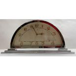 An Art Deco chrome half moon mantel clock