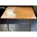 A mid 20th century Ercol beech and elm rectangular breakfast table, with slatted under tier to the