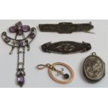 An Edwardian amethyst and seed pearl pendant; two brooches; a locket pendant and a paste set