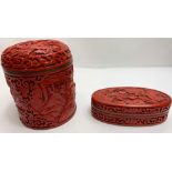 A Chinese cinnabar pot and cover, along with a similar oval pot and cover