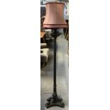 A Victorian cast iron standard lamp, with reeded stem support raised on tripod claw feet,
