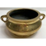 A Chinese two handled bronze censor, the base stamped with a six character mark, 17.5cm wide, 6.