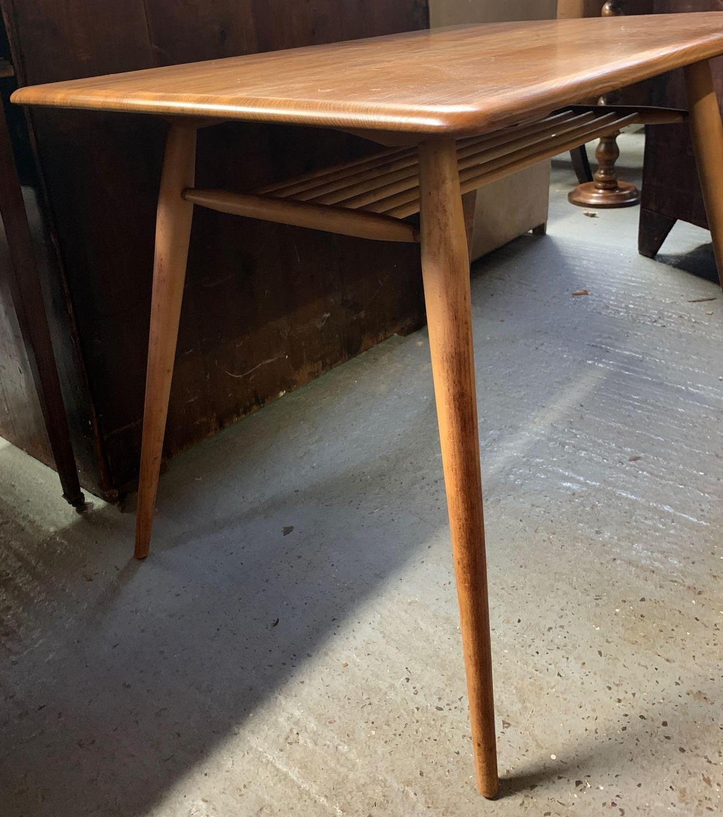 A mid 20th century Ercol beech and elm rectangular breakfast table, with slatted under tier to the - Image 4 of 4