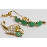 A jade and cultured pearl brooch, unmarked; with a four stone jade panel bracelet, unmarked