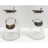 A pair of silver mounted glass whiskey noggins, by Hukin & Heath, Birmingham 1924, of traditional