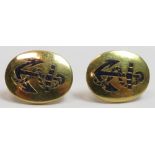 A pair of ear studs, stamped '18', enamelled with a fouled anchor, probably converted from