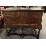 A late 18th century walnut lowboy, with two short and one long drawer, each drawer with two