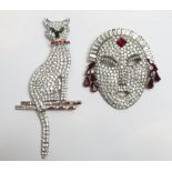 Butler and Wilson, a large paste set Art Deco style female face brooch; with another Butler and