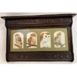 A 20th century stained oak picture frame, decoratively carved with leaves and flowers, with