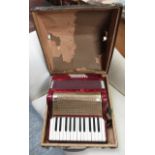 Piano accordion in red marbled case, no makers name, works well and with nice tone