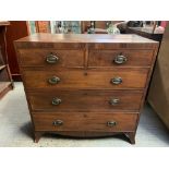 A Victorian mahogany veneer chest of two short and three long drawers, with decorative brass swing