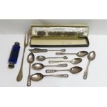 A set of six silver souvenir spoons, pierced with York to the finial; a silver tea spoon; a