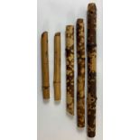 A collection five bamboo recorders