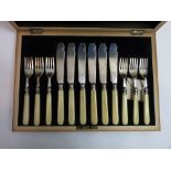 A set of six silver fish knives and forks, by Barker Brothers, Chester 1918, the silver blades and
