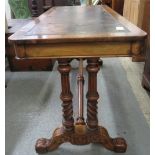 A 19th century walnut veneer library table with dark leather insert with gilt tooling, of