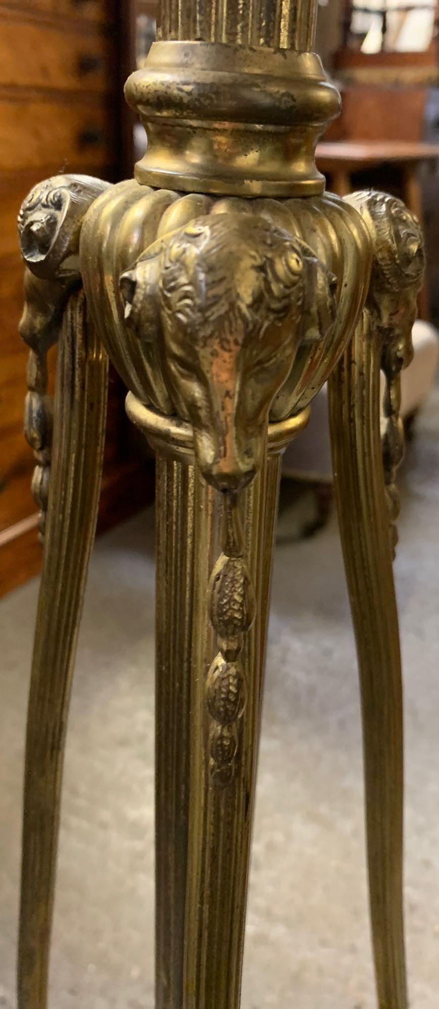 A Victorian brass standard lamp, with a reeded stem support, the circular base with laurel leaf - Image 2 of 4