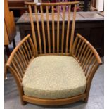An Ercol 'Renaissance' low armchair, with base upholstered in green upholstered fabric but lacking