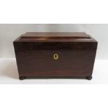 A 19th century rosewood sarcophagus tea caddy, the interior lined with red velvet, ring handle to