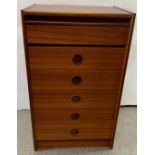 A stained oak mid century chest of six long drawers, by Bath Cabinet Makers Ltd, five drawers with