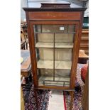 An Edwardian mahogany display cabinet, with inlaid