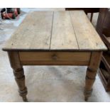 A Victorian pine kitchen table, on four turned leg