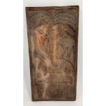 An African carved hardwood panel worked with a man