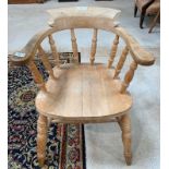 A 19th/20th century pine captains bow back chair,