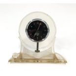 A Smith’s eight day manual wind automobile clock,