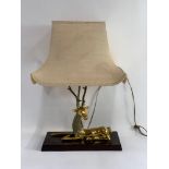 A mid-20th century lamp, the base modelled as a re