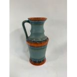 A 20th century German pottery jug, with raised dec