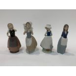 Four Nao figures including a girl with a poodle, 2