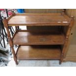 An early 20th century oak three tier buffet, with