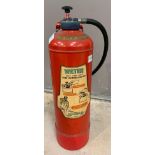 A vintage red painted Minimax water fire extinguis