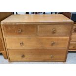 A light oak mid-20th century chest of two short an