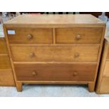 A light oak mid-20th century chest of two short an